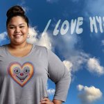 A confident person stands beneath a blue sky with scattered clouds, wearing a shirt with a colorful heart and smiling face. Above them, the words “I LOVE MYSELF” appear in cloud-like letters—symbolizing self-love and emotional wellness.